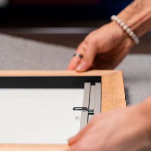 Système de fixation pour photo encadrée